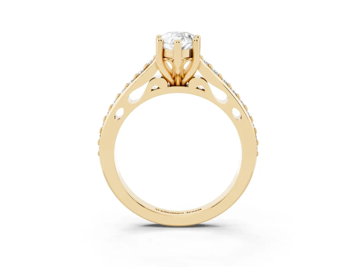 Pear Cut Solitaire Prong Set Diamond Engagement Ring with Pave Band Yellow gold