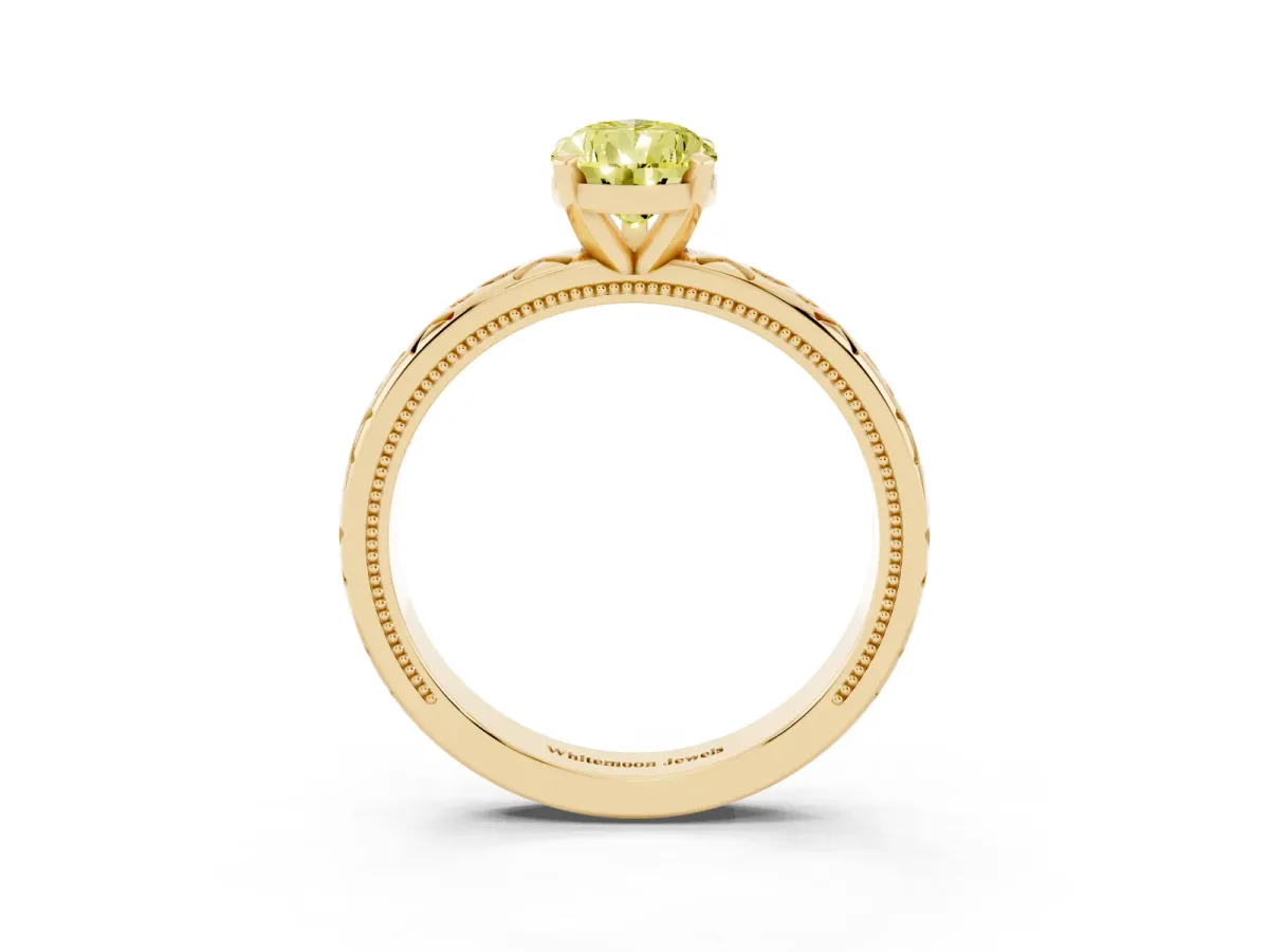 Fancy Yellow Pear Cut Solitaire Engagement Ring with Scrollwork Band and Four-Prong Setting Yellow gold