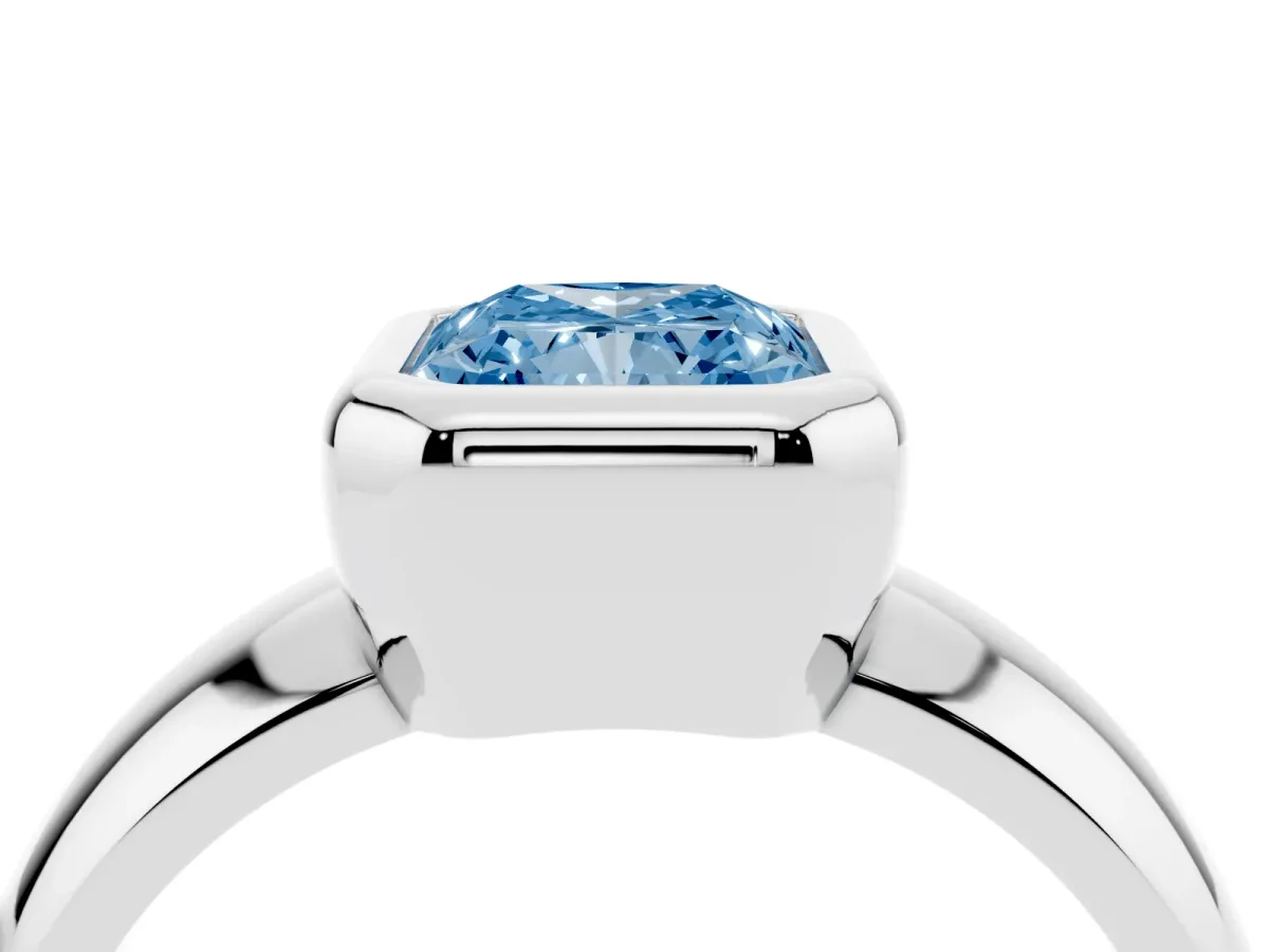 Fancy Blue Bezel Set Radiant Cut Solitaire Ring with Wide Band Silver