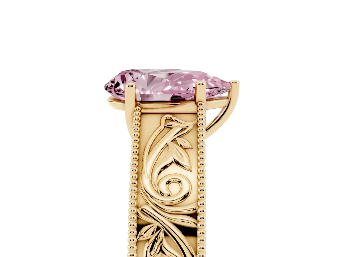 Fancy Pink Pear Cut Diamond Solitaire Ring with Engraved Band and Four-Prong Setting Yellow gold