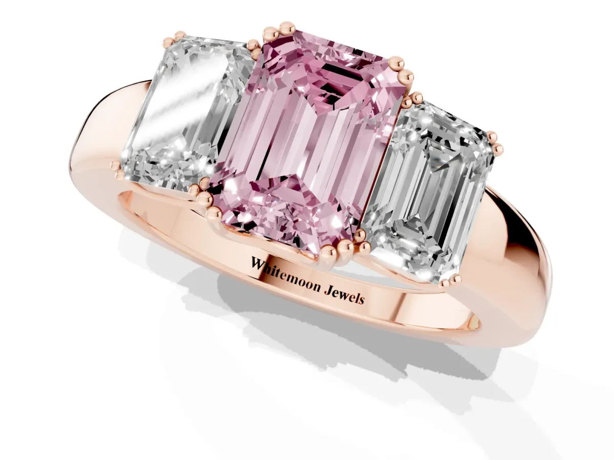 Fancy Pink Three-Stone Emerald Cut Cut Diamond Ring with Channel Set Band and Four-Prong Setting Rose gold