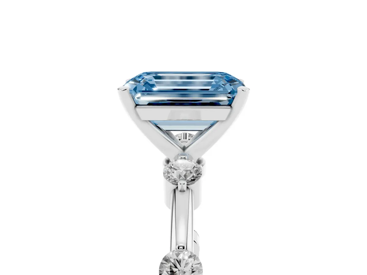 Fancy Blue Emerald Cut Solitaire Diamond Ring with Bezel Set Side Stones and Prong Setting Silver
