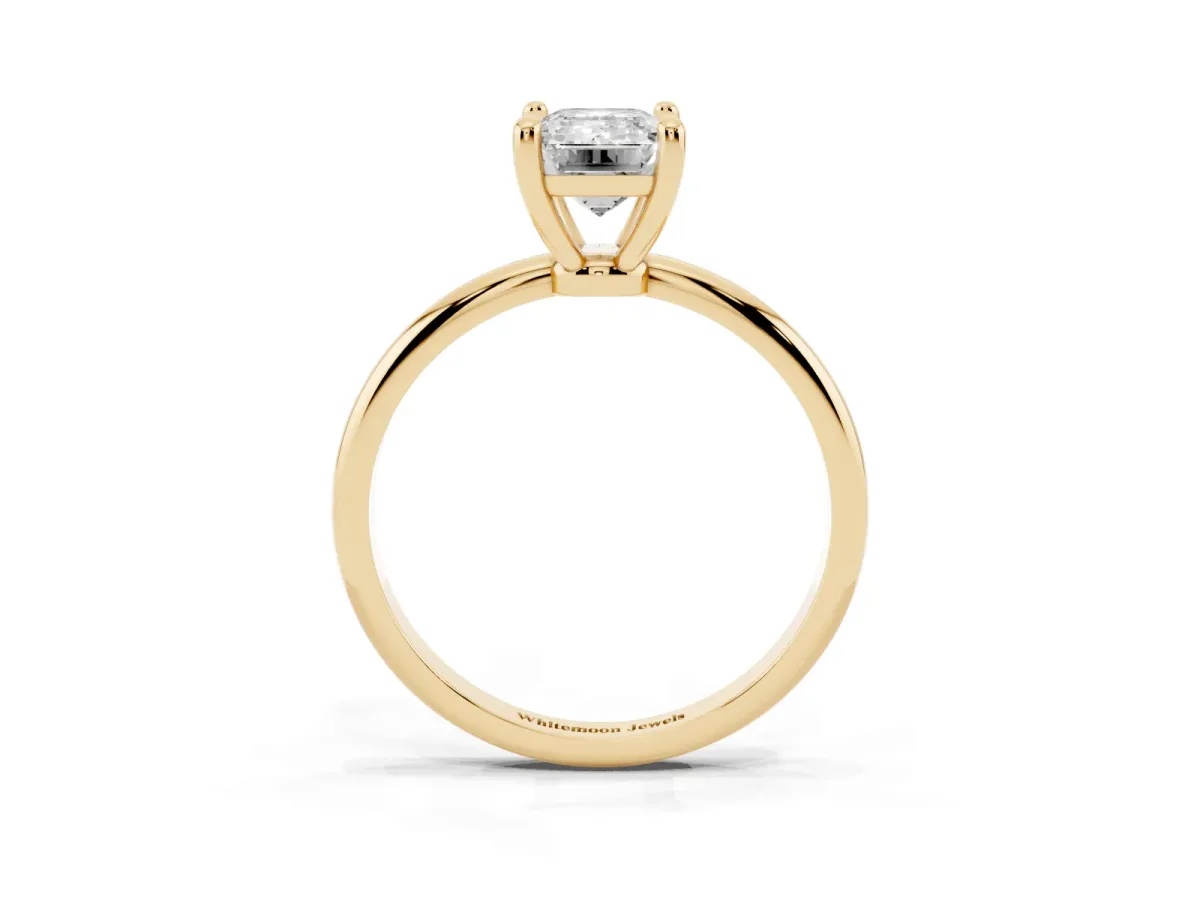 Emerald Cut Solitaire Diamond Ring with 4-Prong Setting on a Classic Band Yellow gold
