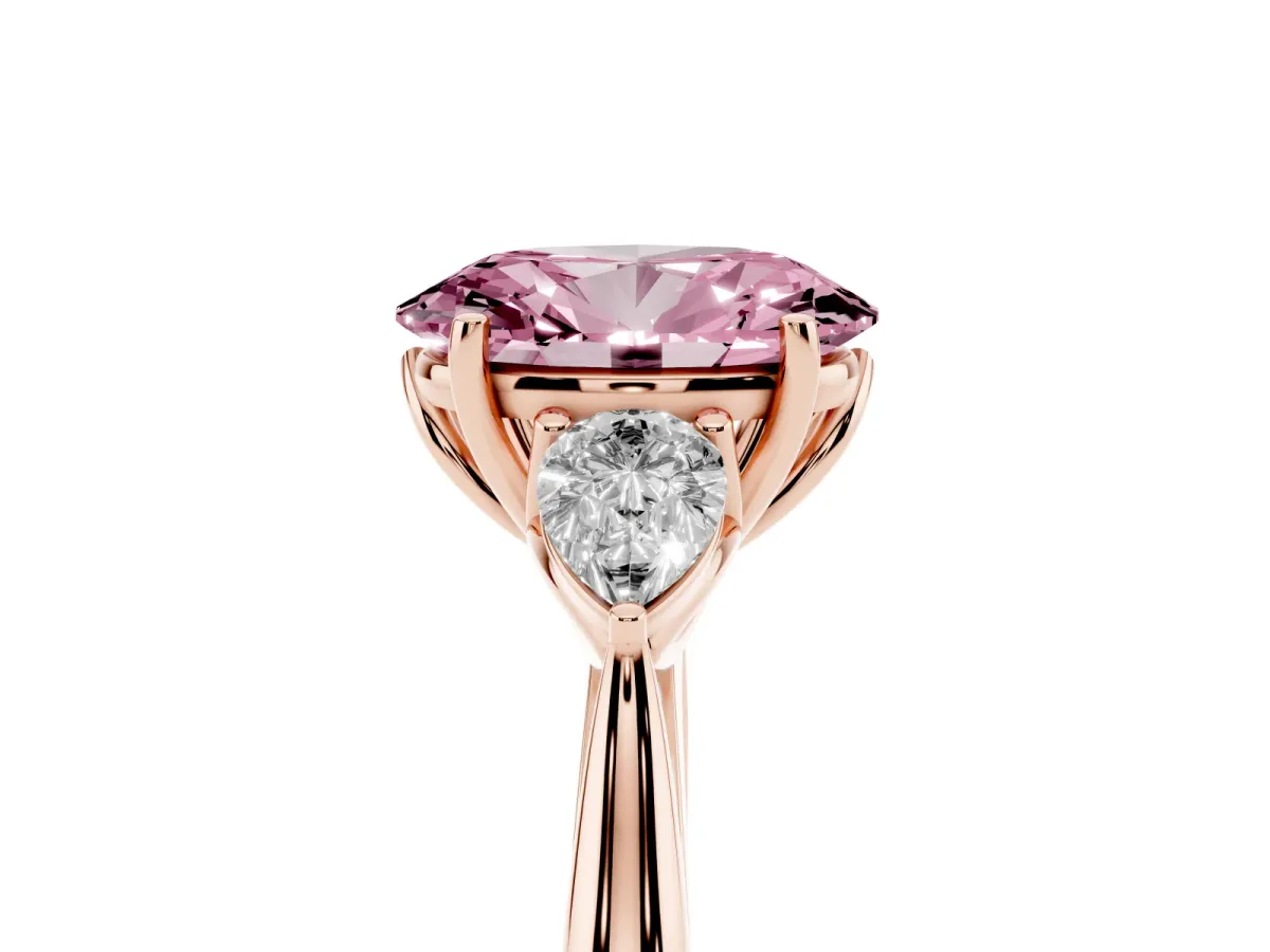 Fancy Pink Three-Stone Oval Cut Diamond Ring with Pear Side Stones in Four-Prong Setting Rose gold