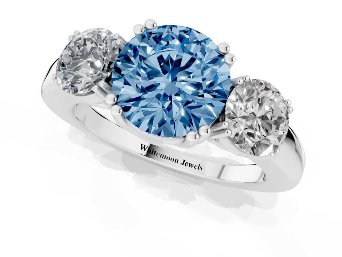 Fancy Blue Three-Stone Round Cut Cut Diamond Ring with Channel Set Band and Four-Prong Setting Silver