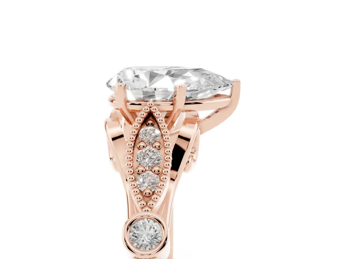 Pear Cut Cut Diamond with Milgrain Marquise and Bezel Accents on a Solitaire Band with Prong Setting Rose gold