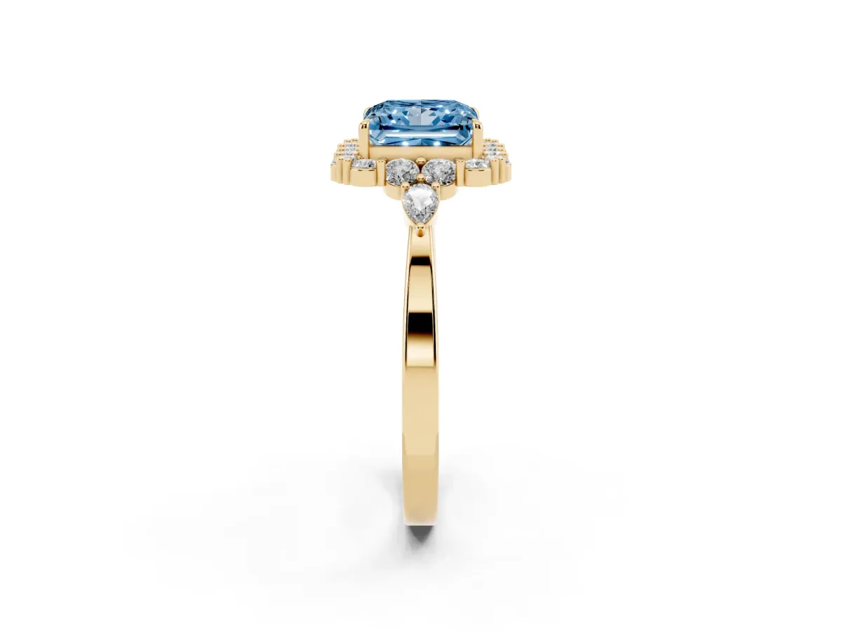 Fancy Blue Princess Cut Diamond Halo Ring with Pear Side Stones and Prong Setting Yellow gold