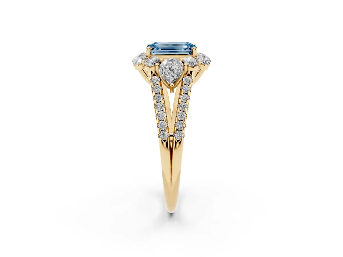 Fancy Blue Emerald Cut Halo Split Shank Diamond Engagement Ring with Prong Setting Yellow gold
