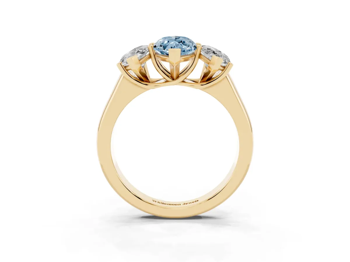 Fancy Blue Marquise Cut Three-Stone Diamond Ring with Prong Setting on a Classic Band Yellow gold