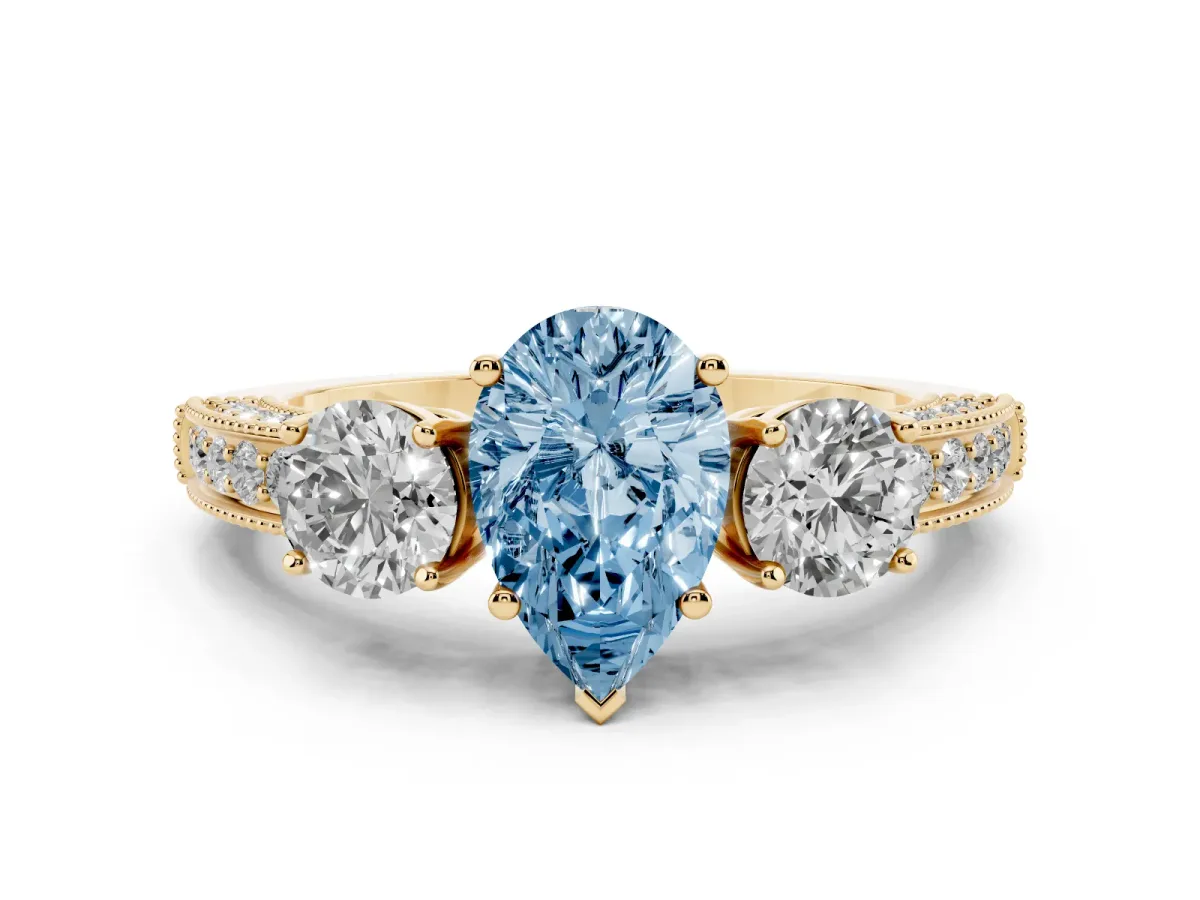 Fancy Blue Pear Cut Three-Stone Diamond Ring with Pavé Band and Four-Prong Setting Yellow gold