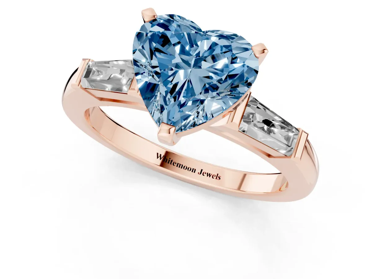 Fancy Blue Heart Cut Solitaire with Tapered Baguette Side Stones on a Classic Band with Four-Prong Setting Rose gold