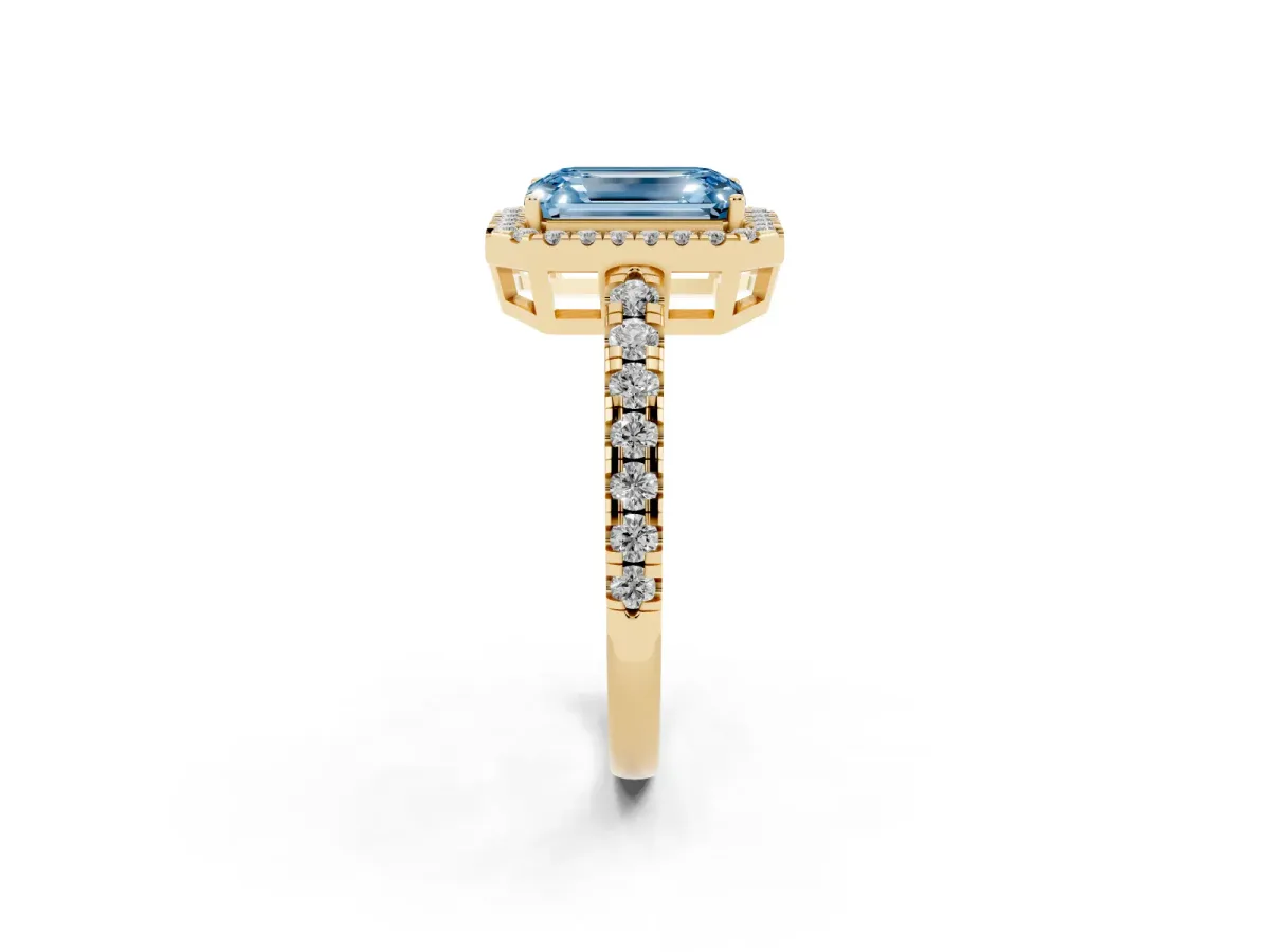 Fancy Blue Emerald Cut Diamond Halo Ring with Pavé Band and Four-Prong Setting Yellow gold
