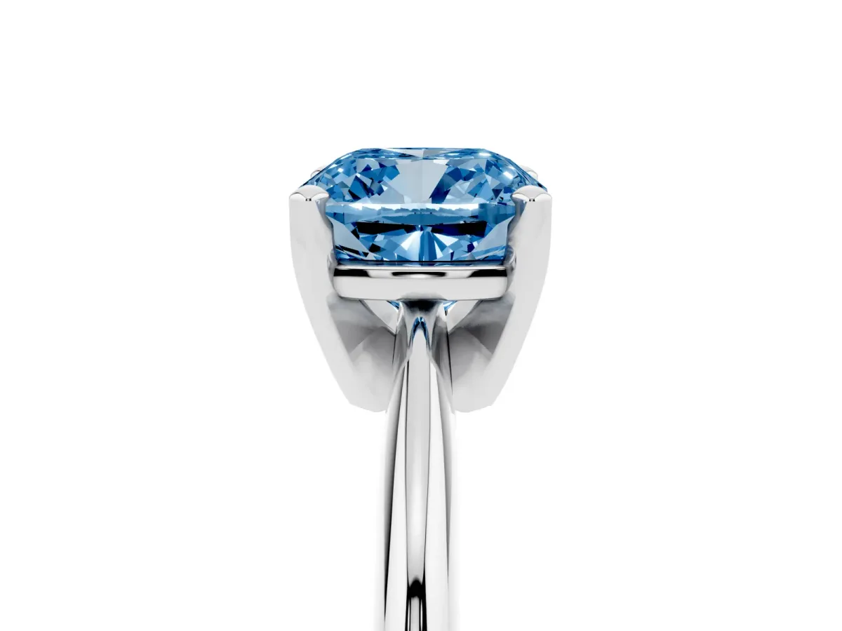 Fancy Blue Cushion Cut Cut Solitaire Ring with Four-Prong Setting on a Classic Band Silver