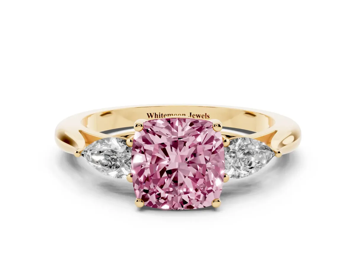 Fancy Pink Three-Stone Cushion Cut Diamond Ring with Pear Side Stones in Four-Prong Setting Yellow gold