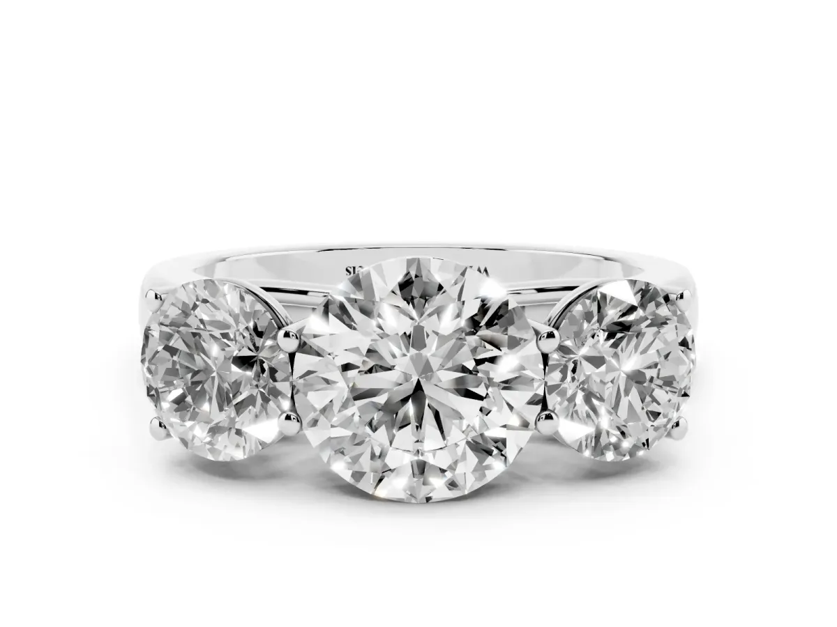 Round Cut Three-Stone Diamond Ring with Prong Setting on a Classic Band Platinum