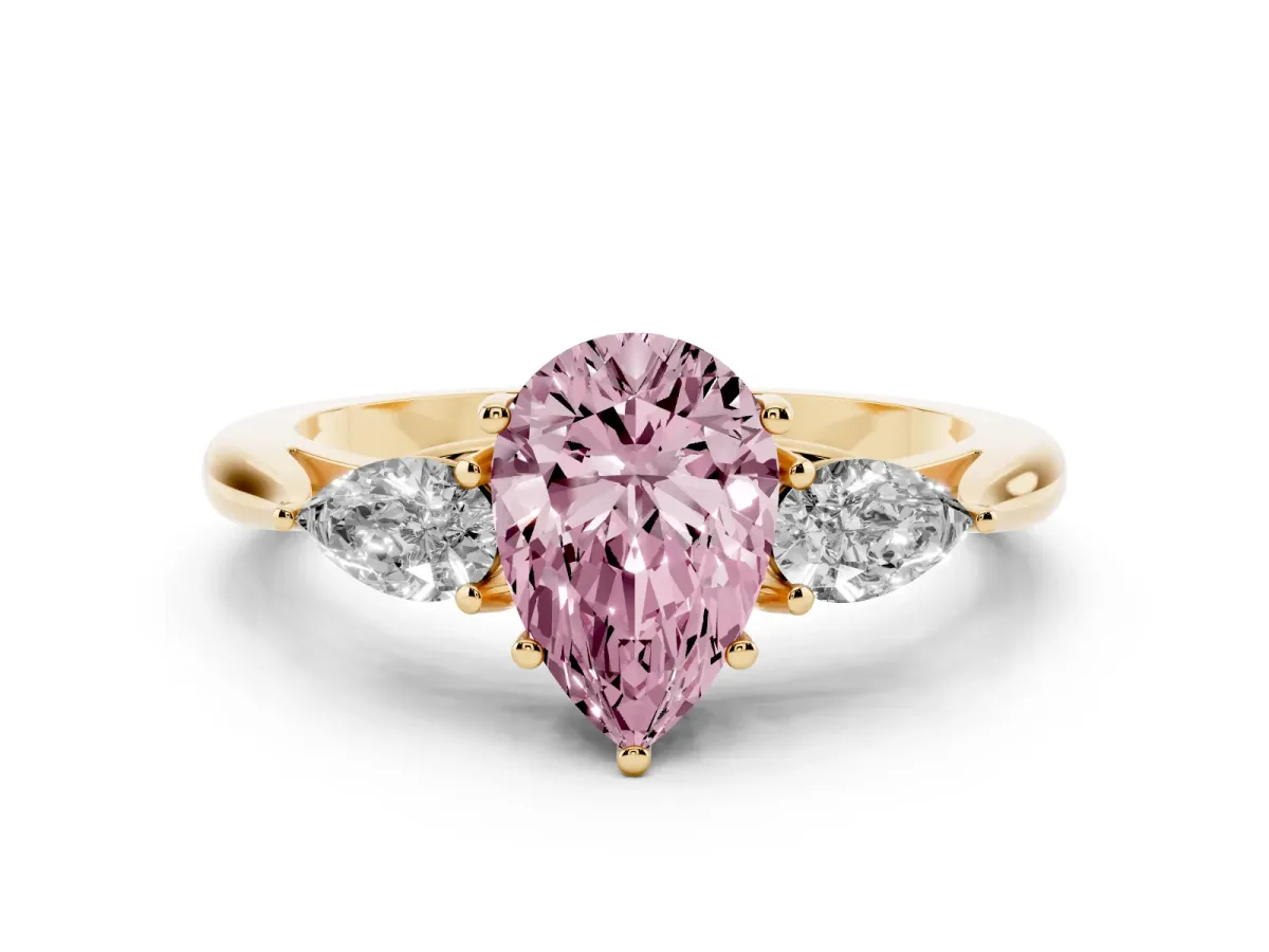 Fancy Pink Three-Stone Pear Cut Brilliant Diamond Solitaire Ring with Tapered Band and Four-Prong Setting Yellow gold