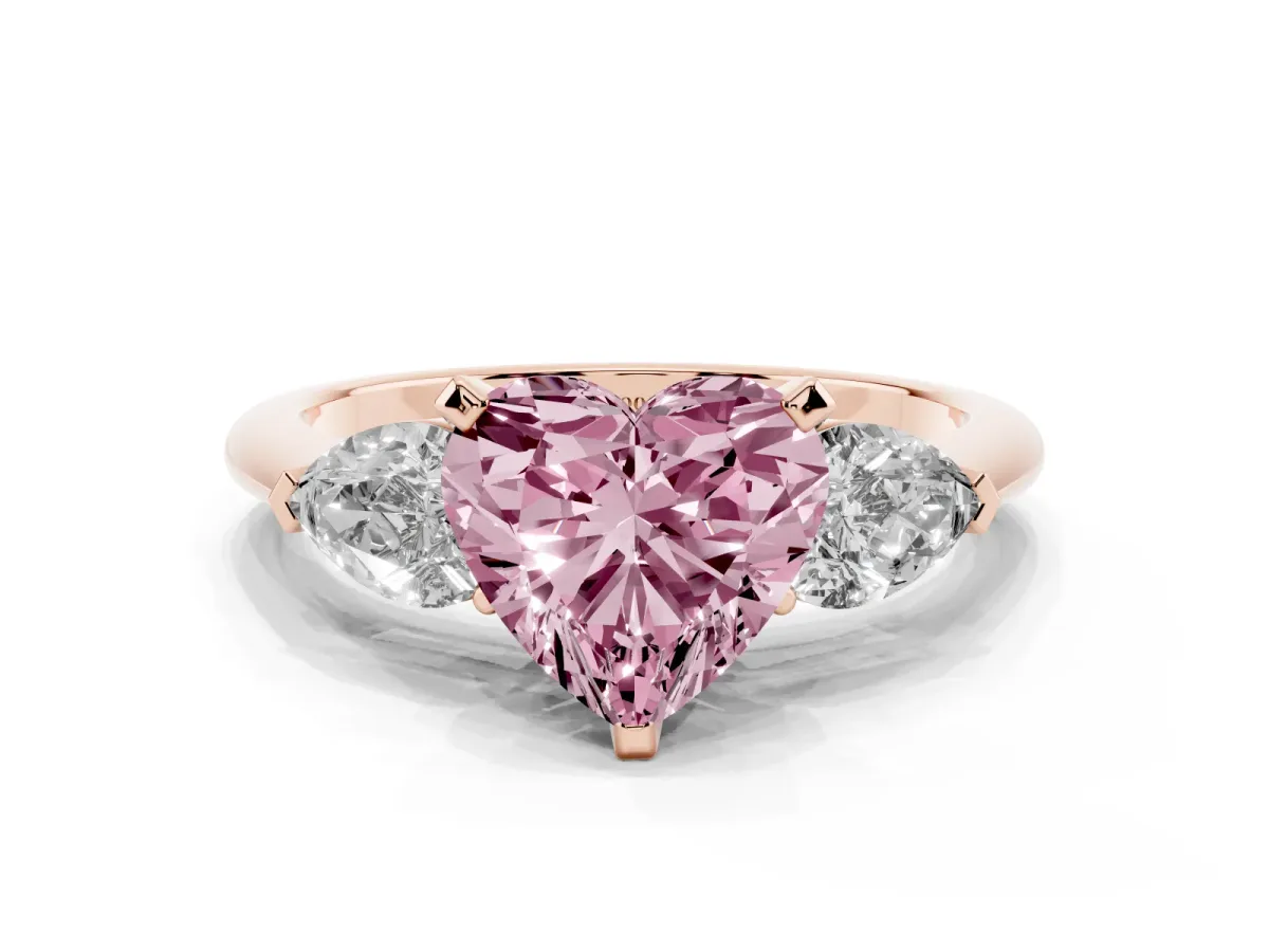 Fancy Pink Three-Stone Heart Cut Diamond Ring with Pear Side Stones and Four-Prong Setting Rose gold