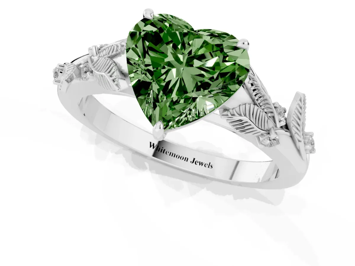 Fancy Green Heart Cut Diamond Solitaire Ring with Leaf Motif Band and Four-Prong Setting Silver