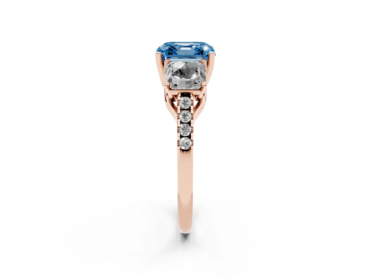 Fancy Blue Three-Stone Asscher Cut Diamond Ring with Round Pavé Band and Prong Setting Rose gold