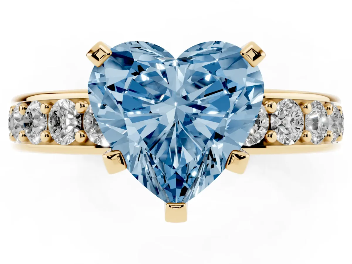 Fancy Blue Heart Cut Diamond Engagement Ring with Channel Set Round Band and Prong Setting Yellow gold