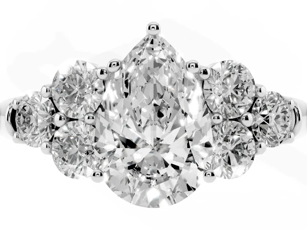 Pear Cut Cut Diamond Cluster Ring with Round Accent Stones and Prong Setting on a Classic Band White gold