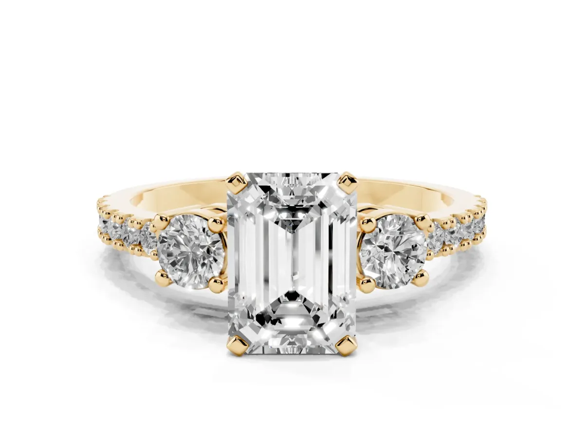 Emerald Cut Three-Stone Diamond Pavé Band with Prong Setting Yellow gold