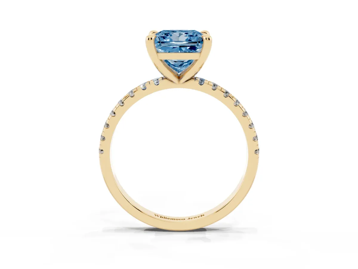 Fancy Blue Princess Cut Diamond Brilliant Solitaire Ring with Pavé Band and Four-Prong Setting Yellow gold