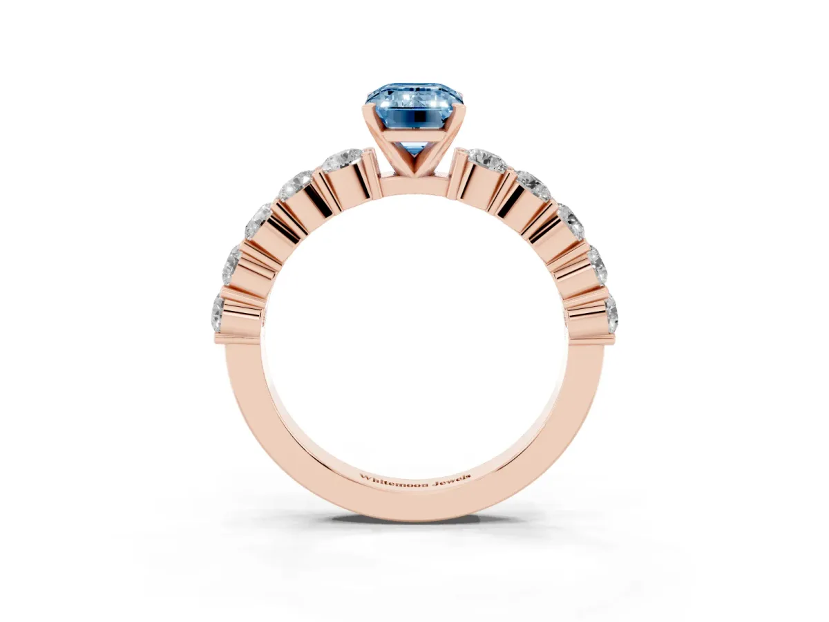 Fancy Blue Emerald Cut Diamond Solitaire Ring with Shared Prong Round Side Stones Rose gold
