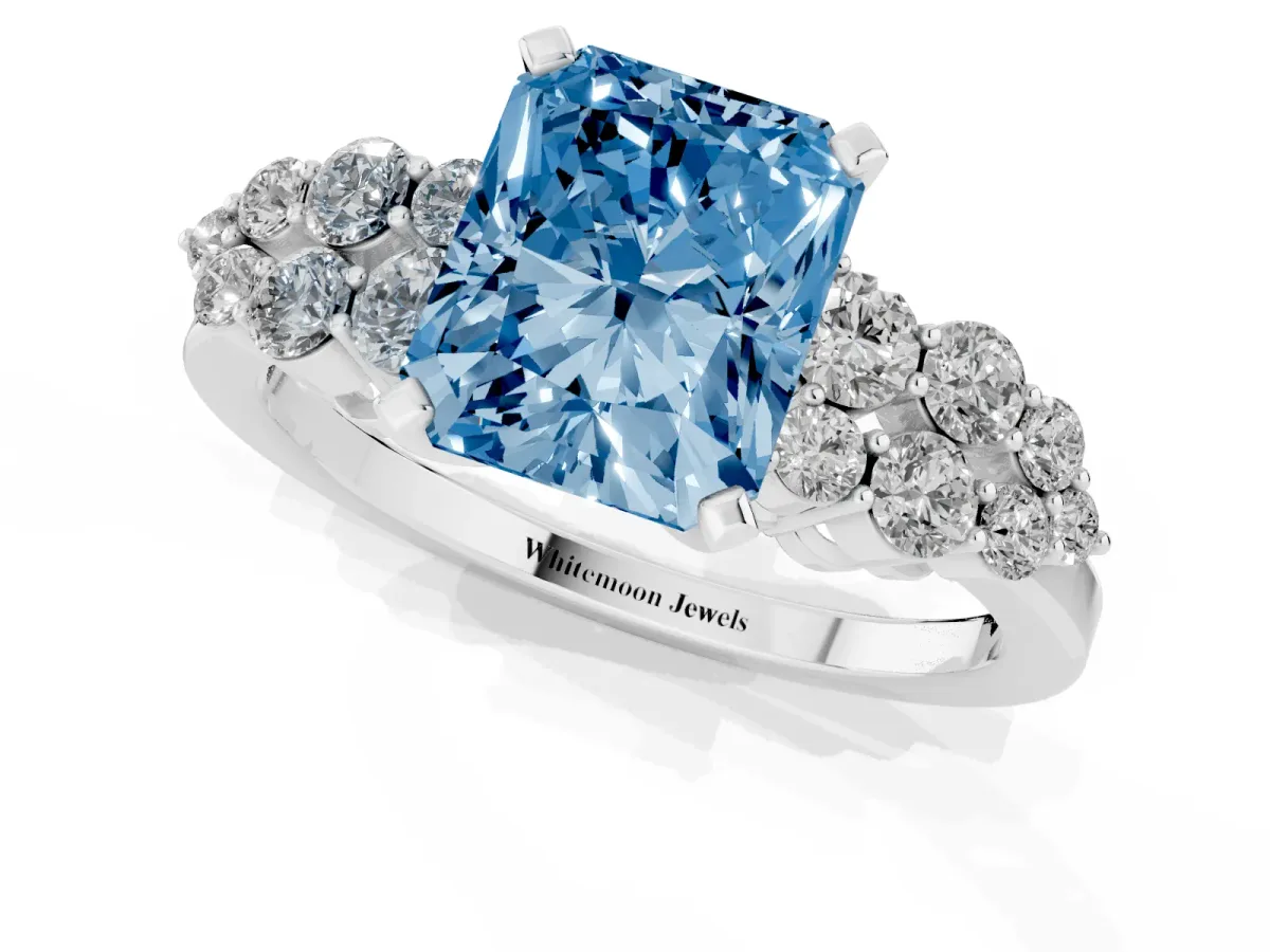 Fancy Blue Radiant Cut Cluster Diamond Engagement Ring with Pavé Band and Four-Prong Setting Silver