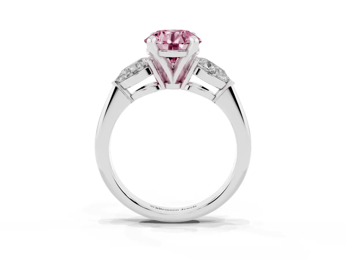 Fancy Pink Three-Stone Round Cut Diamond Ring with Pear Side Stones and Four-Prong Setting Platinum