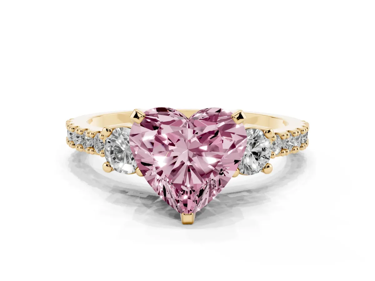 Fancy Pink Heart Cut Three-Stone Diamond Pavé Band with Prong Setting Yellow gold