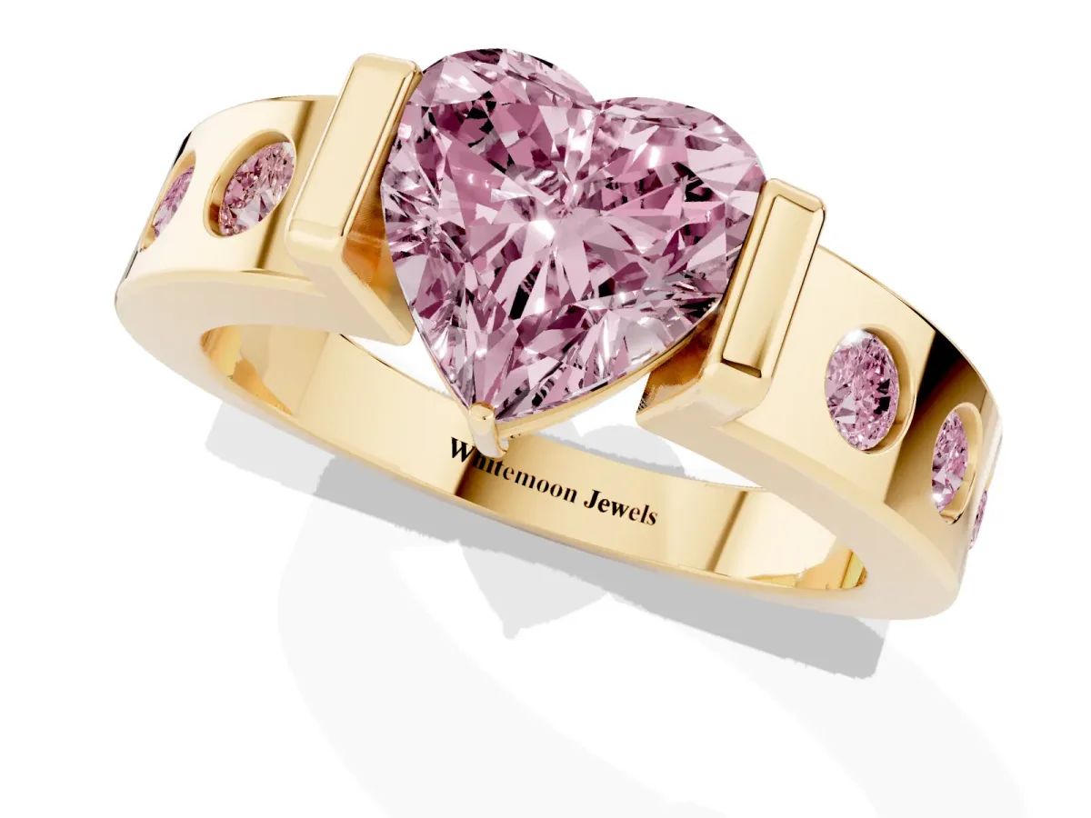 Fancy Pink Heart Cut Brilliant Channel-Set Diamond Ring with Bezel Prong Setting Yellow gold