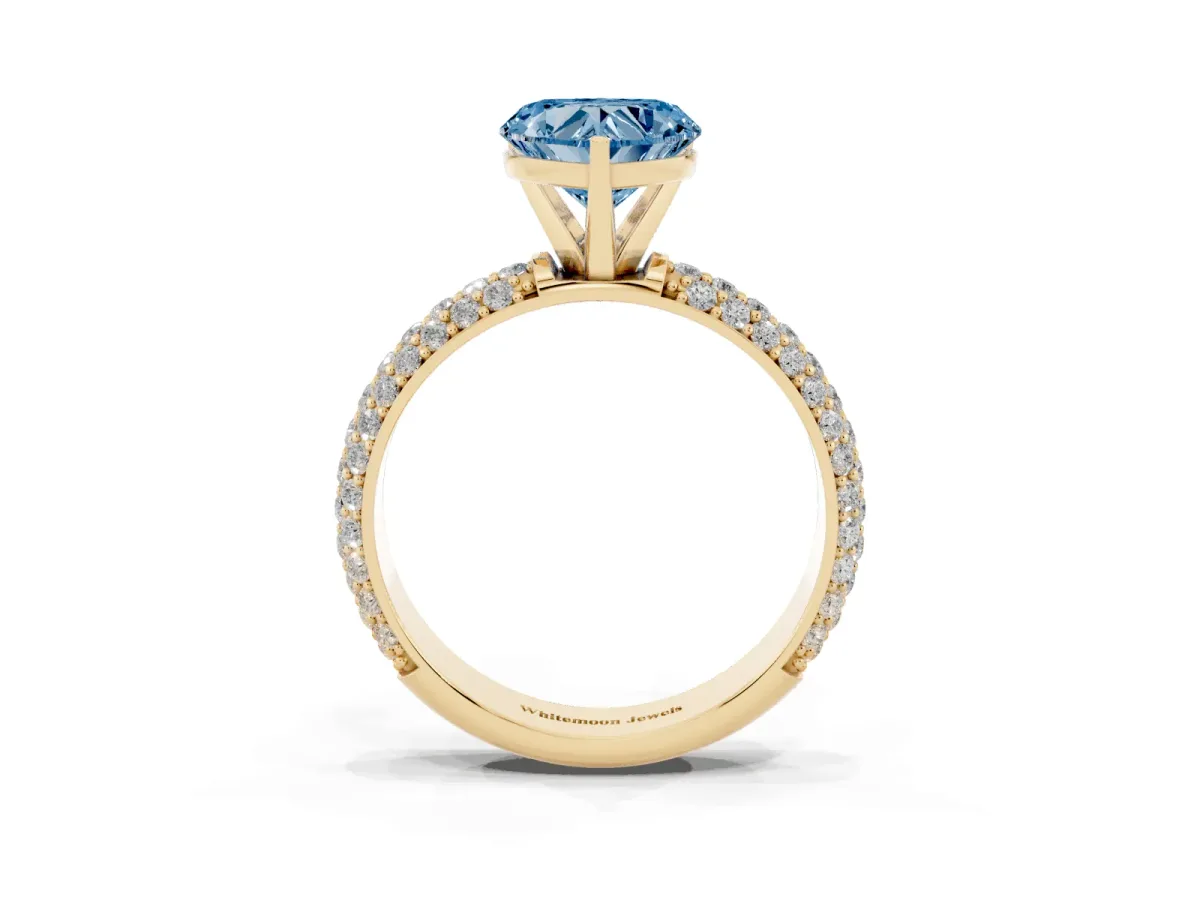 Fancy Blue Heart Cut Diamond Solitaire Ring with Prong Setting and Pavé Band Yellow gold