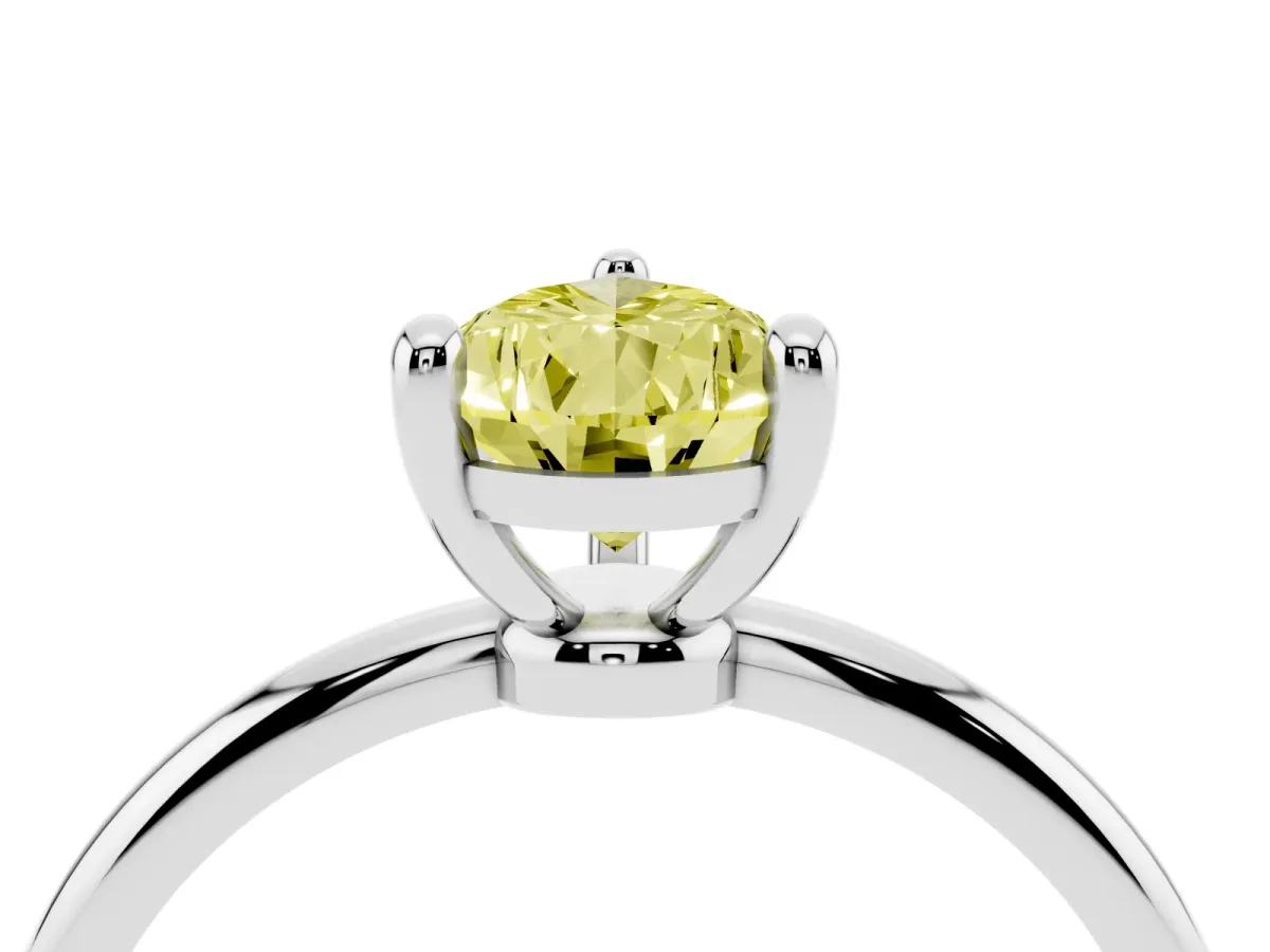 Fancy Yellow Pear Cut Solitaire Diamond Ring with 4-Prong Setting on a Classic Band Silver