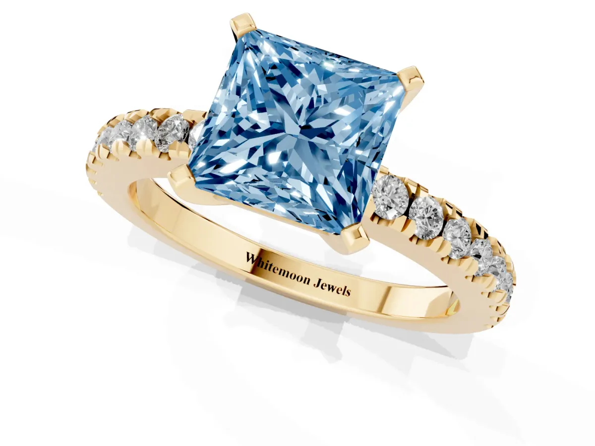 Fancy Blue Princess Cut Solitaire Diamond with Pavé Band and Four-Prong Setting Yellow gold