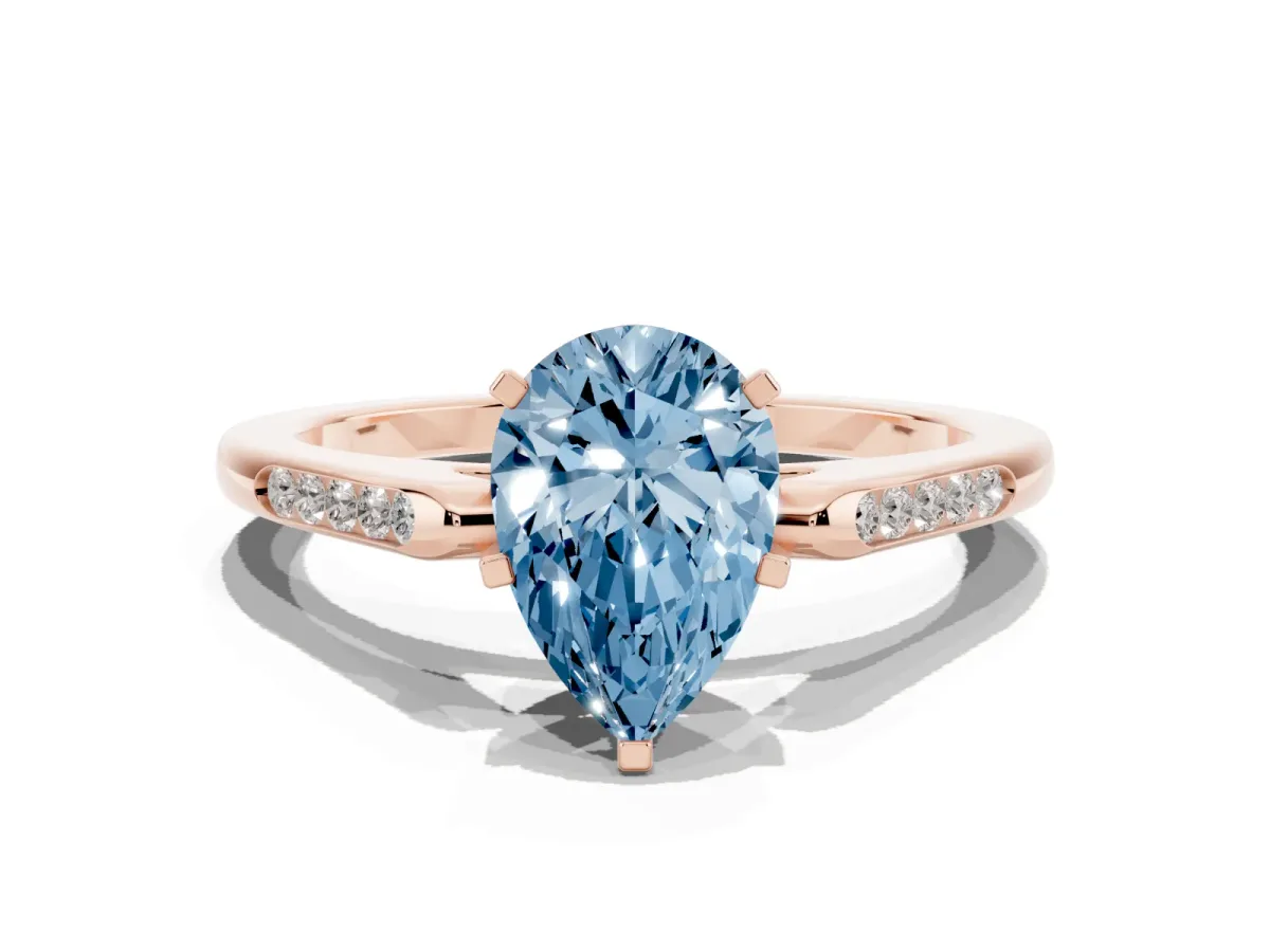 Fancy Blue Pear Cut Diamond Solitaire Ring with Channel Set Round Band and Prong Setting Rose gold