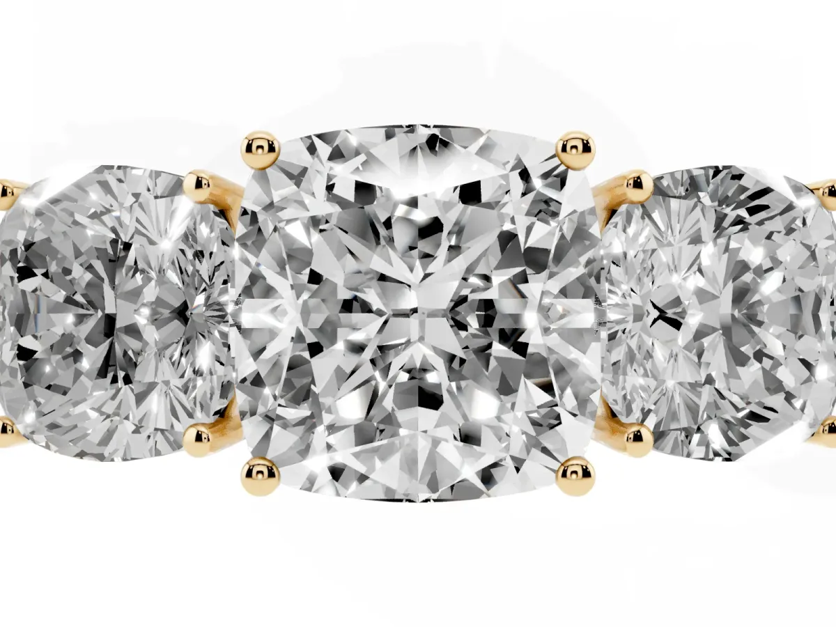 Cushion Cut Diamond Three-Stone Ring with Prong Setting and Textured Band Yellow gold