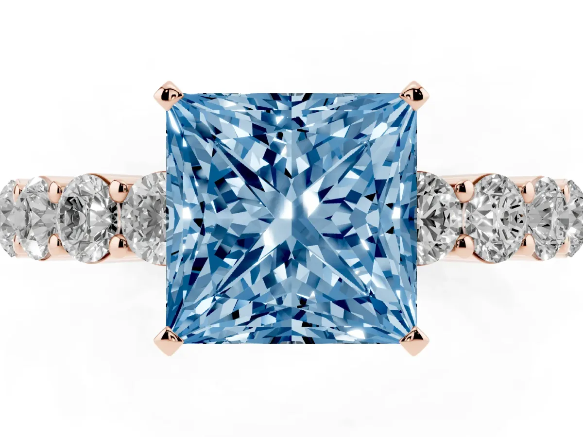 Fancy Blue Princess Cut Diamond Solitaire Ring with Shared Prong Round Side Stones Rose gold