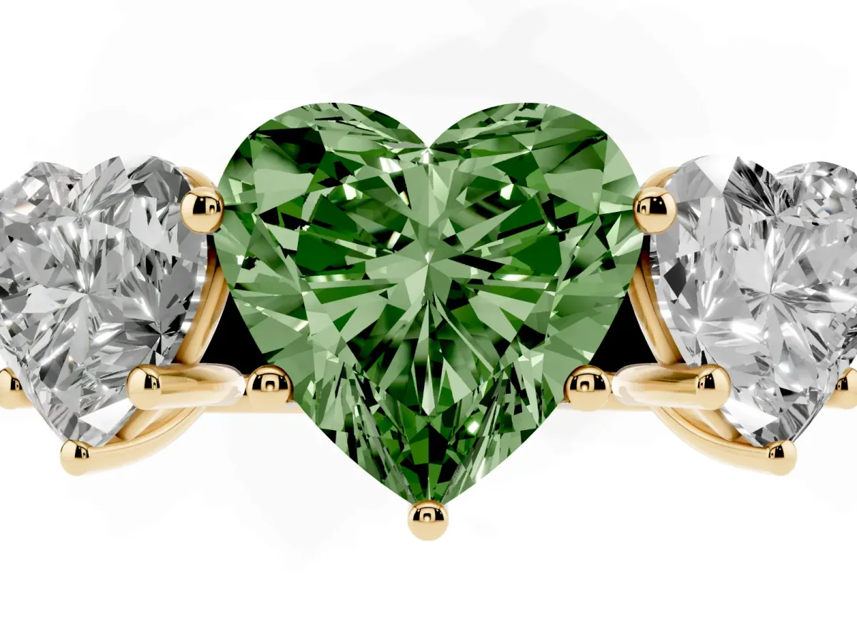 Fancy Green Heart Cut Three-Stone Diamond Ring with Prong Setting on a Classic Band Yellow gold