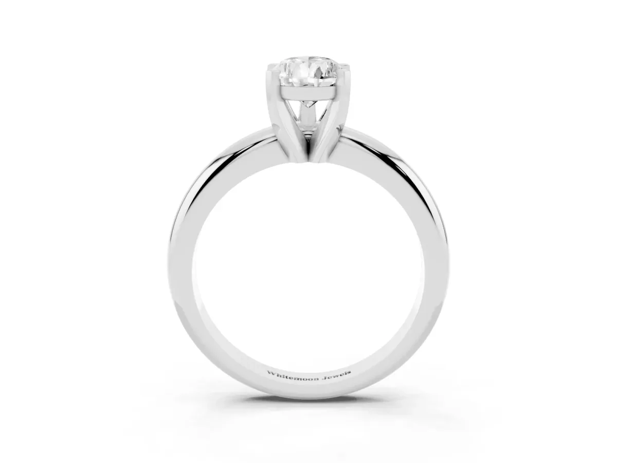 Pear Cut Diamond Solitaire Engagement Ring with Round Band and Four-Prong Setting White gold