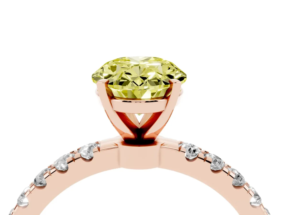 Fancy Yellow Oval Cut Diamond Solitaire Ring with Pavé Accents and Four-Prong Setting Rose gold