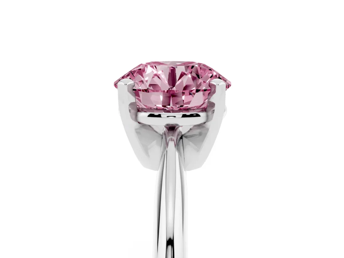 Fancy Pink Round Cut Cut Solitaire Ring with Four-Prong Setting on a Classic Band Silver