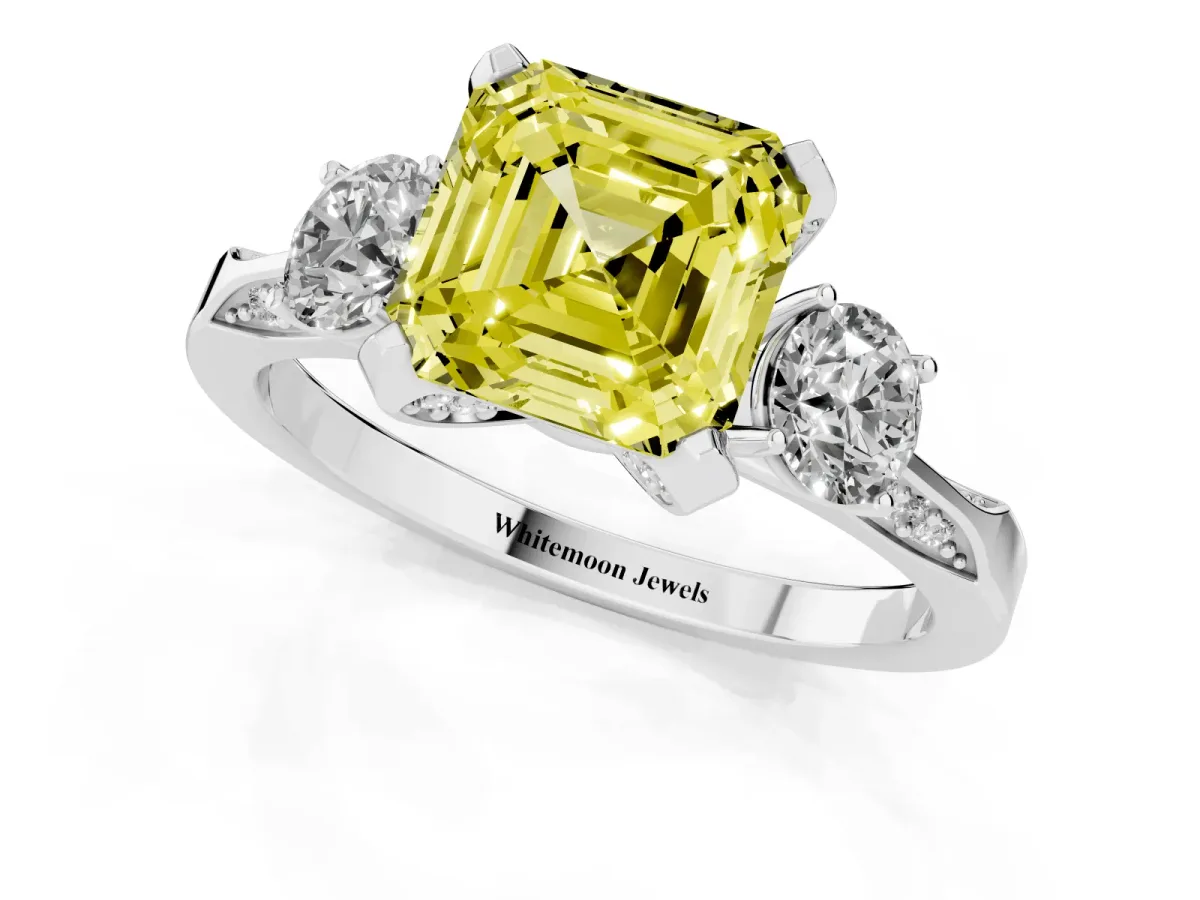 Fancy Yellow Asscher Cut Brilliant Three-Stone Diamond Ring with Pavé Band and Four-Prong Setting White gold