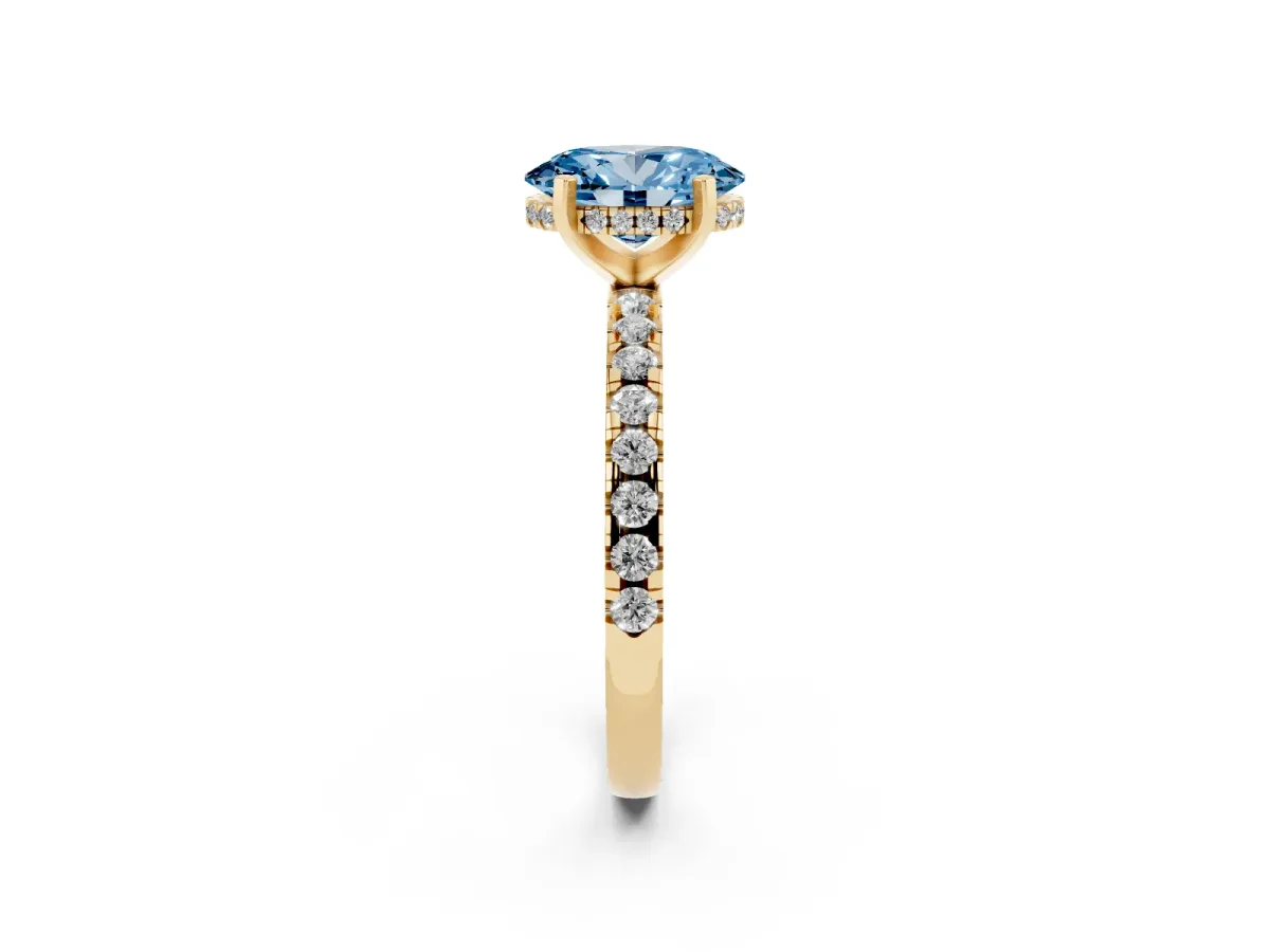 Fancy Blue Oval Cut Diamond Solitaire Ring with Round Pavé Band and Four-Prong Setting Yellow gold