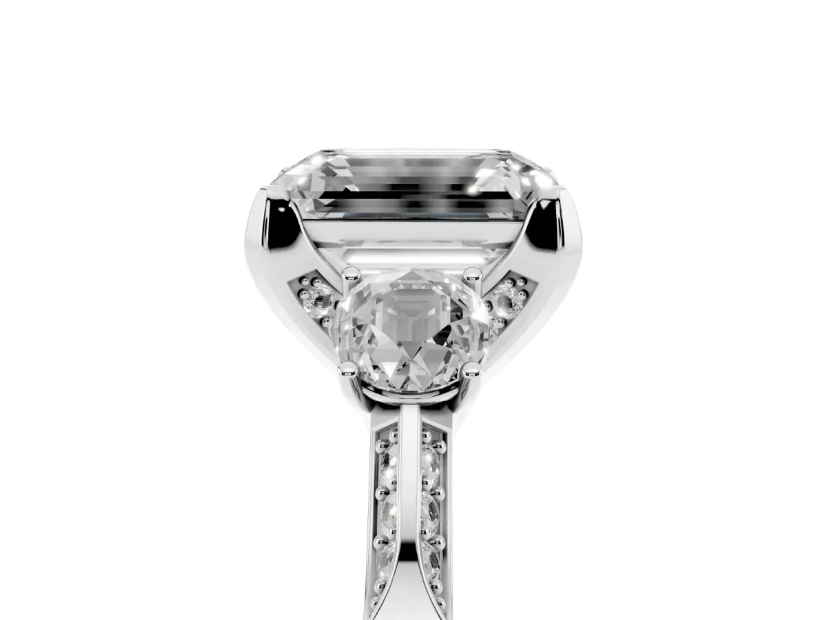 Emerald Cut Brilliant Three-Stone Diamond Ring with Pavé Band and Four-Prong Setting White gold