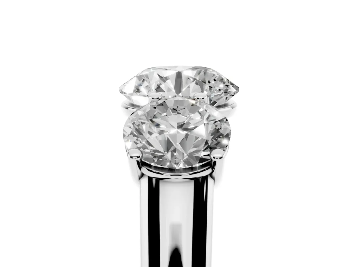 Round Cut Three-Stone Diamond Ring with Prong Setting on a Classic Band Platinum