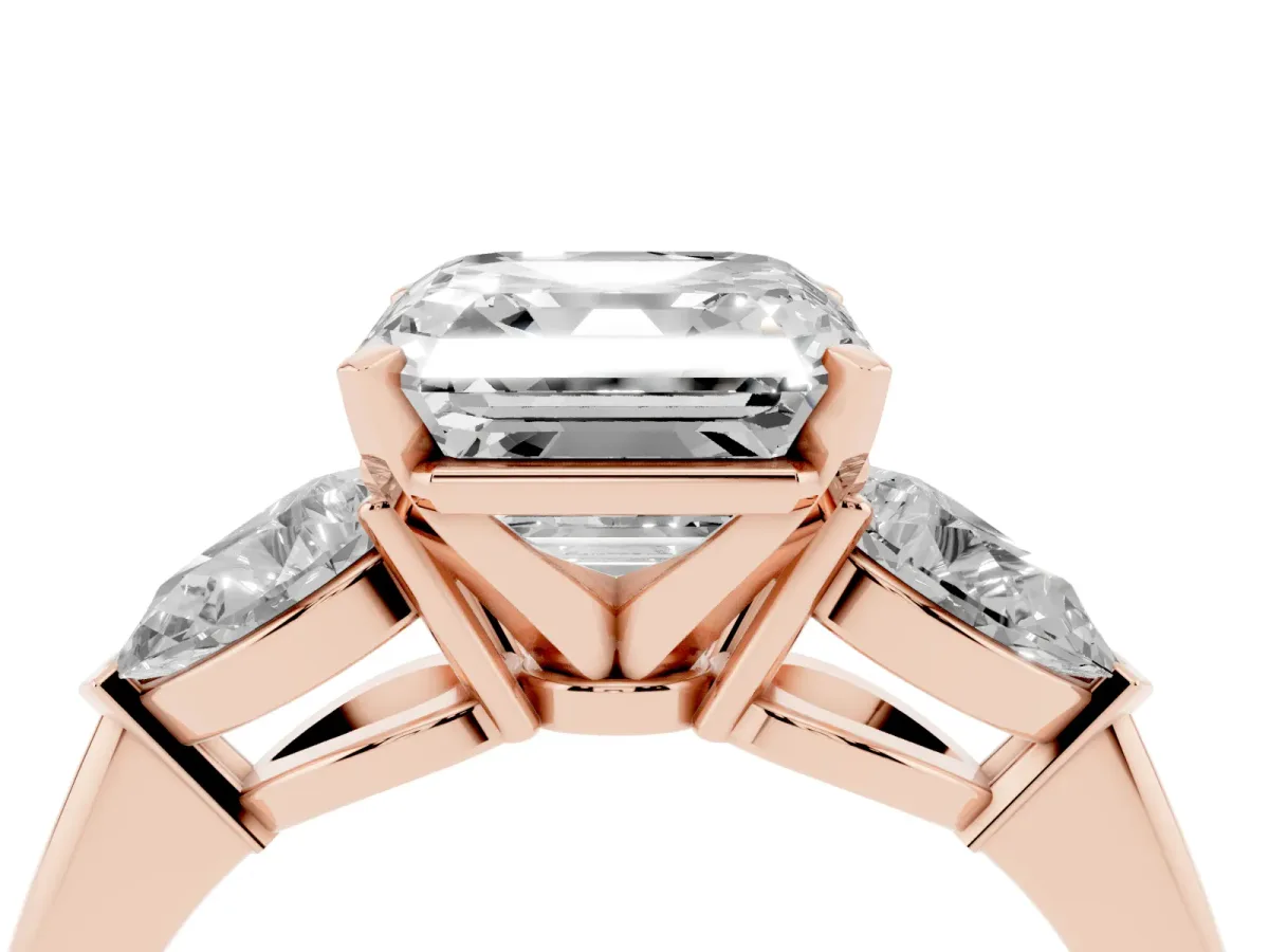 Three-Stone Asscher Cut Diamond Ring with Pear Side Stones and Four-Prong Setting Rose gold