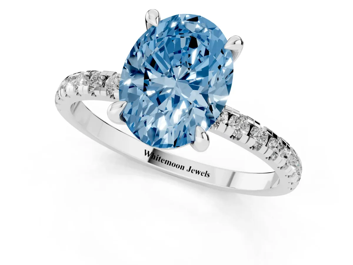 Fancy Blue Oval Cut Diamond Brilliant Solitaire Ring with Pavé Band and Four-Prong Setting Platinum