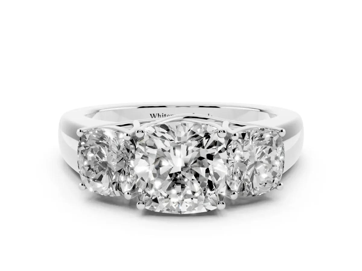 Three-Stone Cushion Cut Cut Diamond Ring with Prong Setting and Classic Band Platinum