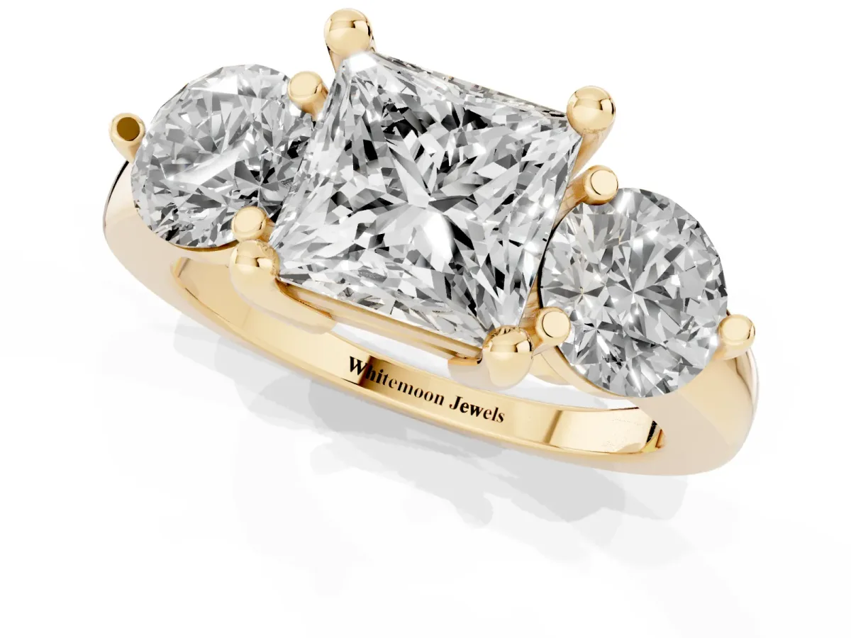 Three-Stone Princess Cut Brilliant Cut Solitaire Ring with Prong Setting on a Classic Band Yellow gold